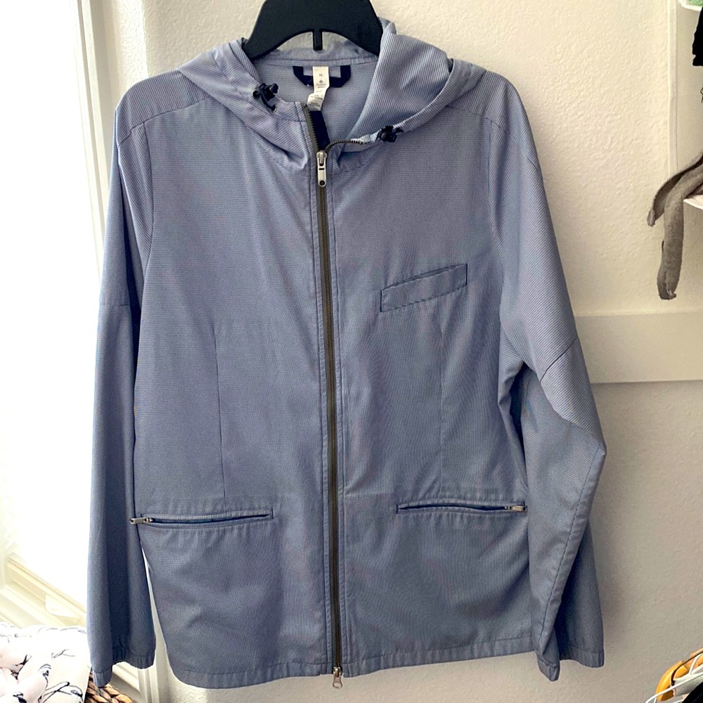 Navy and white hooded Lululemon rain jacket